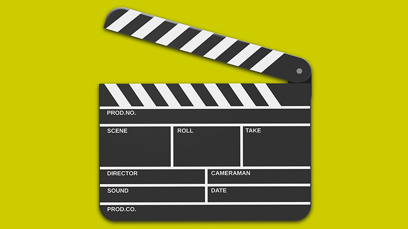 KI (Werbe-) Filmproduktion Filmklappe mit gelben Hintergrund.